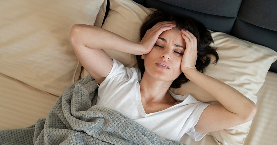 A woman feeling distressed due to a lack of proper sleep