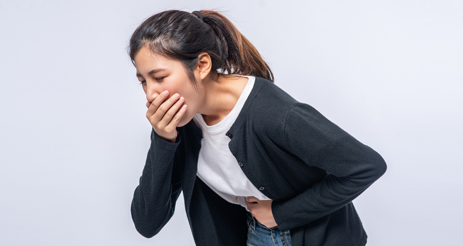 A woman suffering from nausea.