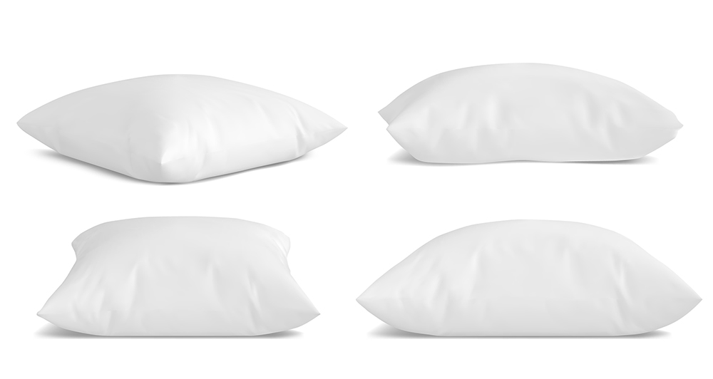 Different sizes of white pillows