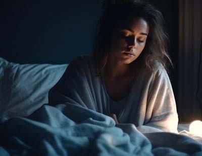 A woman unable to sleep signifying sleep disorder