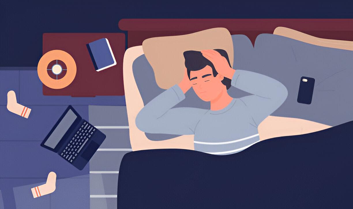 A man sleeping with a headache because of the strain accumulated from constantly using digital devices