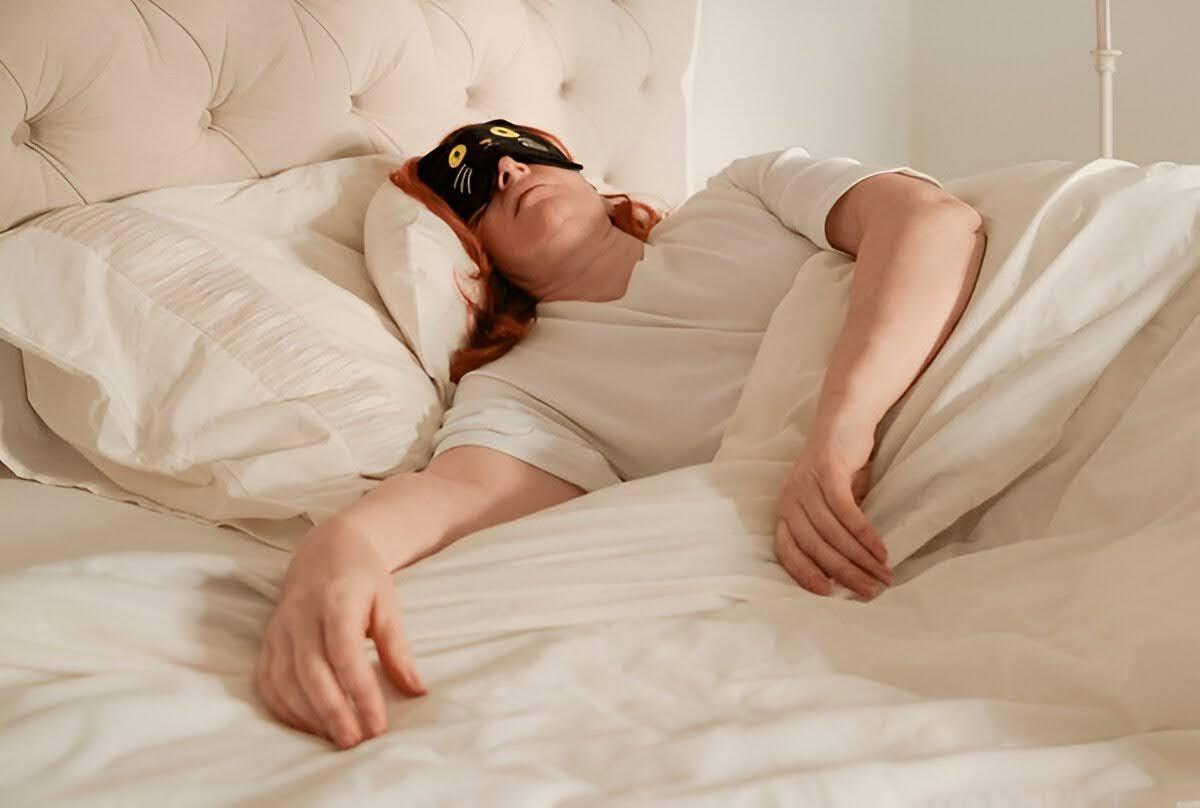 Woman Wearing Eye Mask and Sleeping in an Improper Position