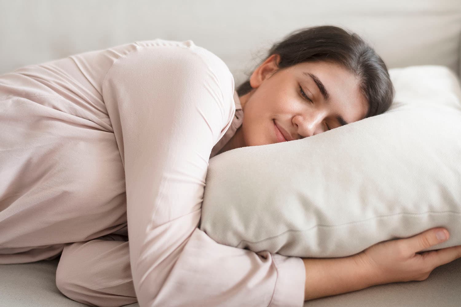 A woman sleeping comfortably on her side