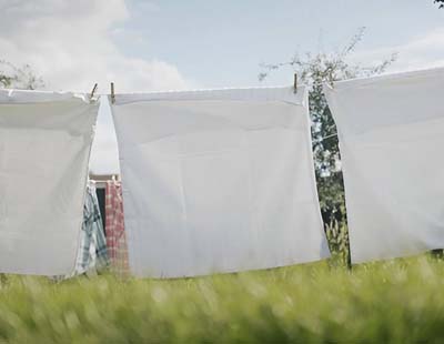 Pillowcases clipped on a wire to air dry