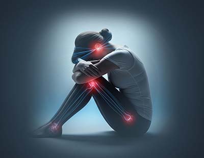 A graphic representation of a woman, emphasizing on common points of pain and pressure