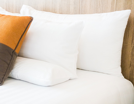 Pillows assorted on a bed