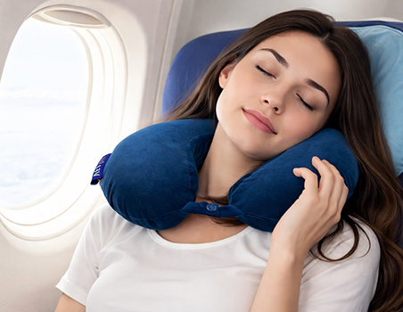 A woman using a travel neck pillow