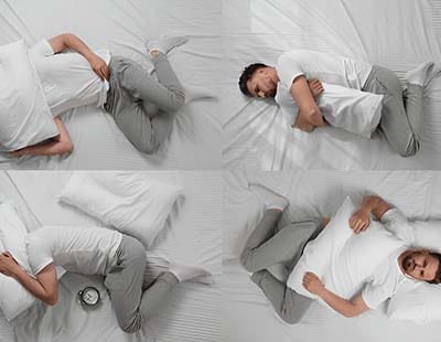 A man in uncomfortable sleeping positions and struggling to sleep