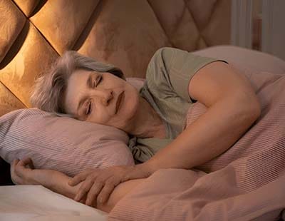 An elderly woman sleeping peacefully