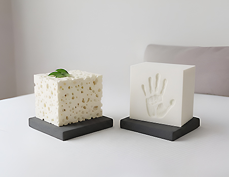 Latex cube on the left and memory foam cube on the right.