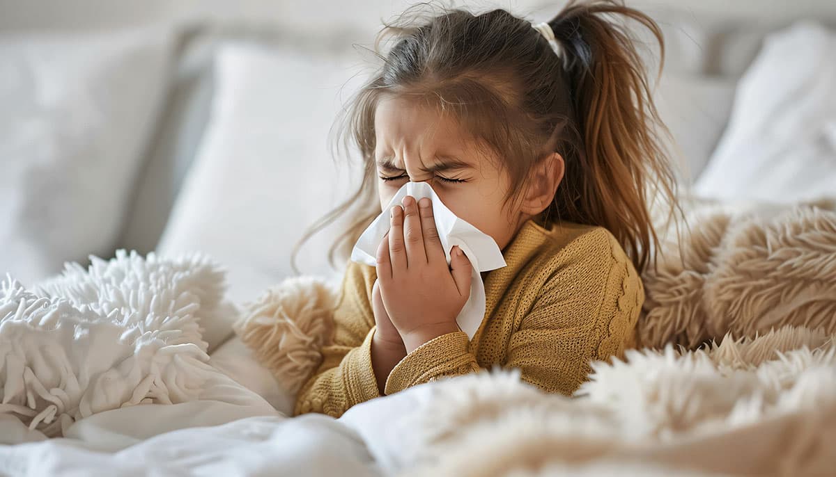 A girl sneezing
