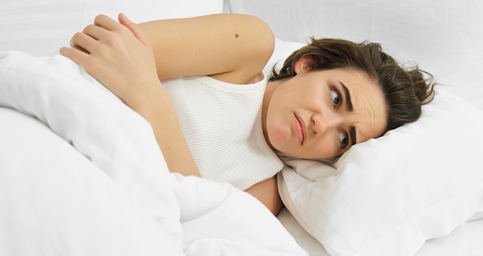 A woman with a numb hand after sleeping.