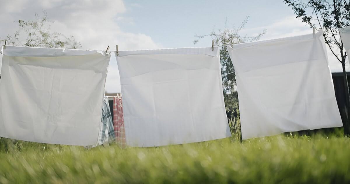 Pillowcases clipped on a wire to air dry