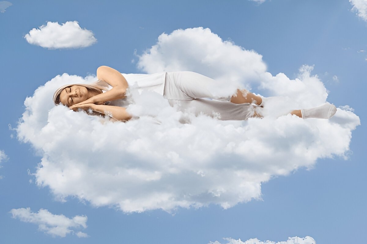 A woman in a deep sleep rests on a soft cloud, surrounded by a calm, dreamy sky, symbolizing serenity and comfort