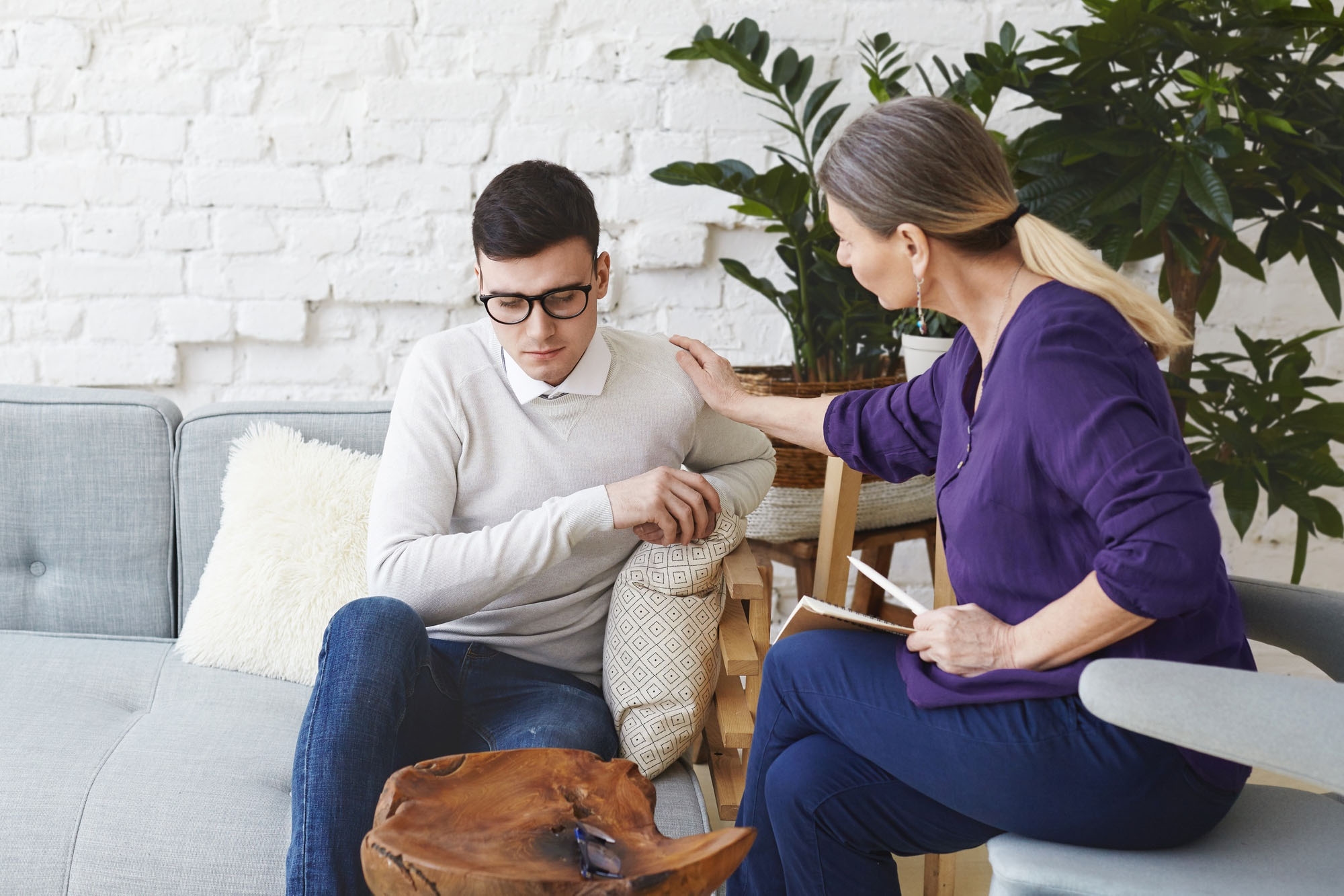 A medical expert conducting psychotherapy on a patient