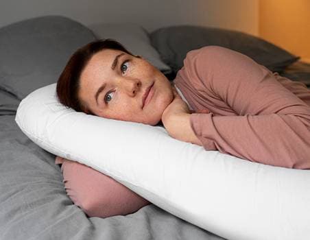 A middle-aged woman seems to be distressed.