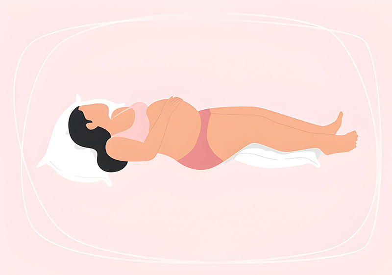 A pregnant woman lying on her back with pillows under her head and knees