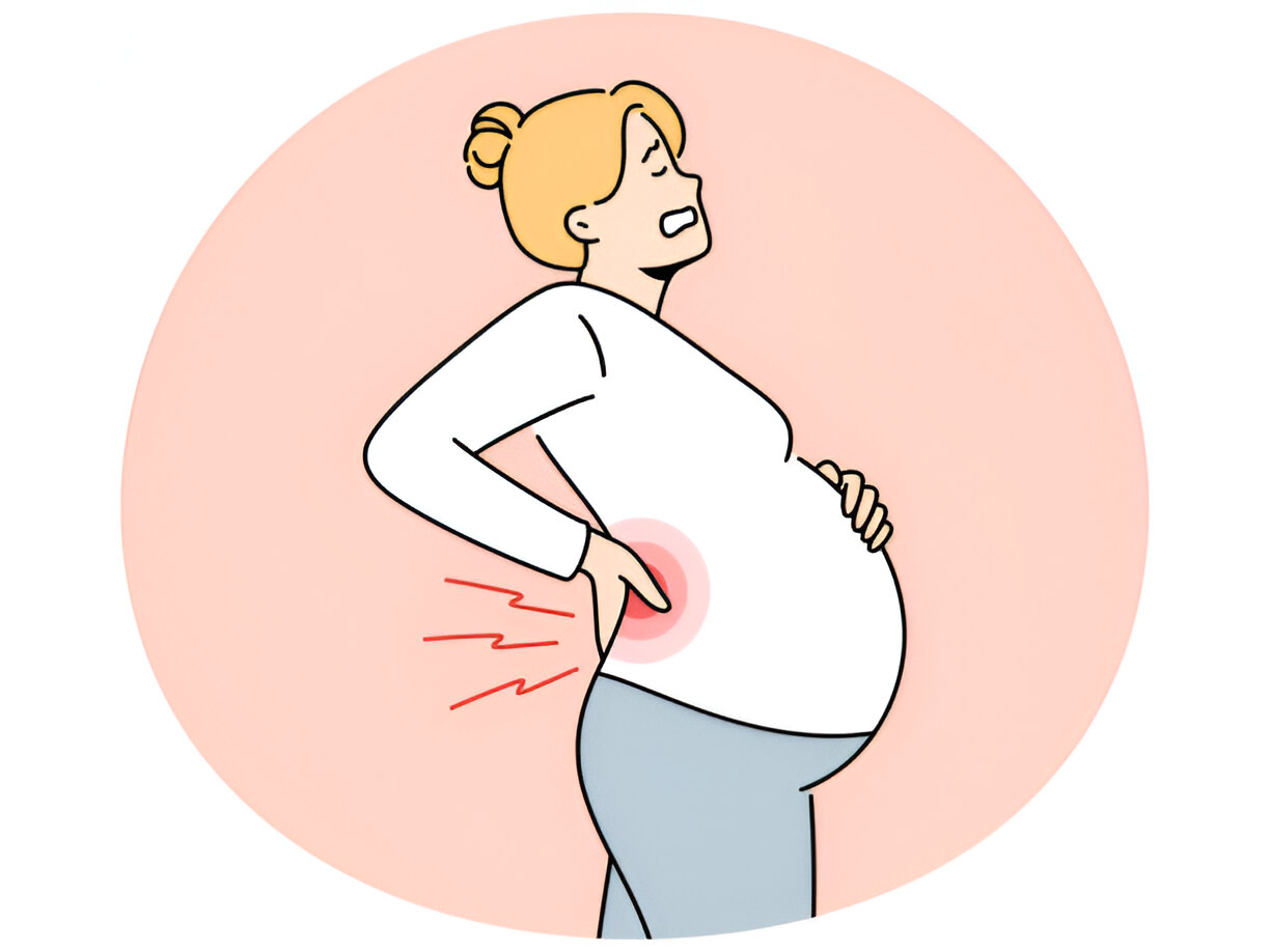 A Woman Agonizing with Back Pain During Pregnancy