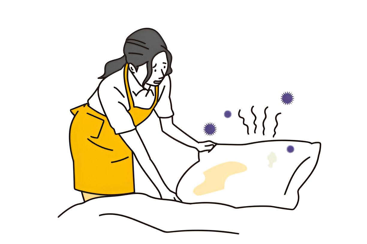 A woman trying to change a pillow full of stains and germs